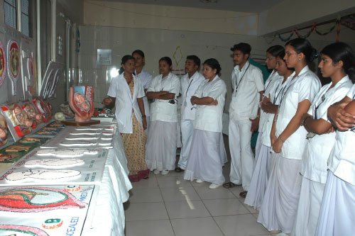 Students at Vijayanagar College of Nursing learning about nursing care.