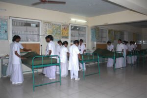 Students at Vijayanagar College of Nursing learning about nursing care.