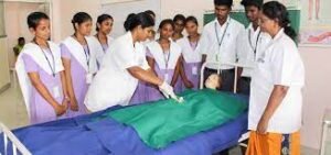 Students of Rabindranath Tagore Nursing College are practicing nursing skills in a hospital setting.