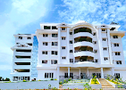 Exterior of Vidyarathna College of Nursing Udupi, showcasing its modern architecture and lush green campus.